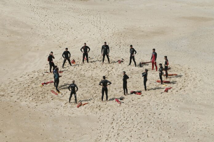 Photo by Margarida CSilva people standing forming a circle during daytime