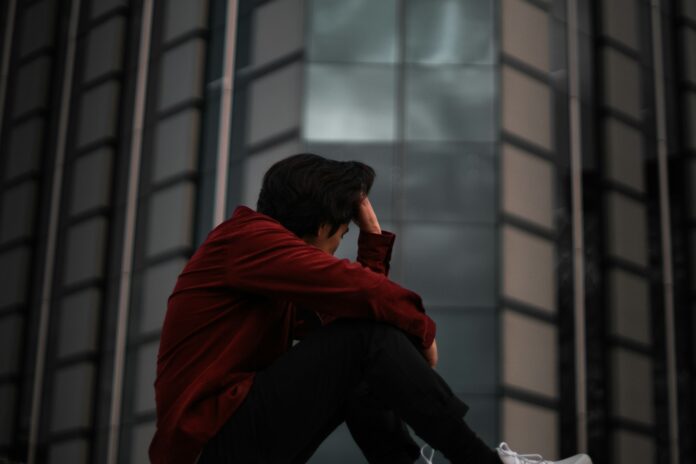 Photo by Cristian Castillo man in red jacket