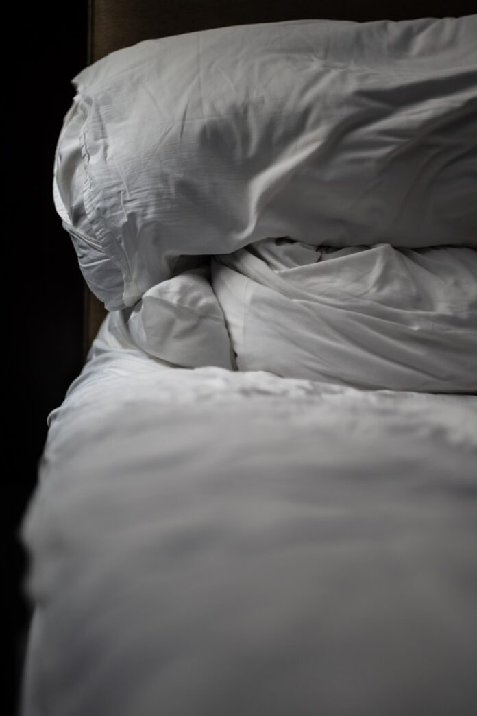 Photo by Rob LaVeck a white pillow on a bed