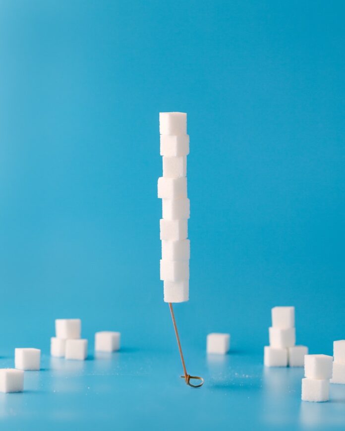 Photo by Mae Mu white cubes on blue surface